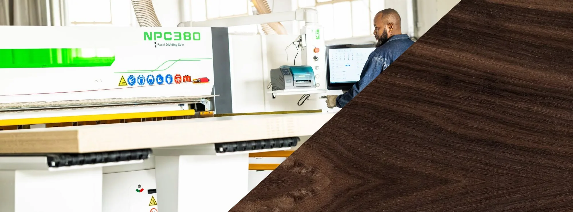 An operator at the controls of the NPC380 CNC panel dividing saw in the Colin Mathews Joinery workshop