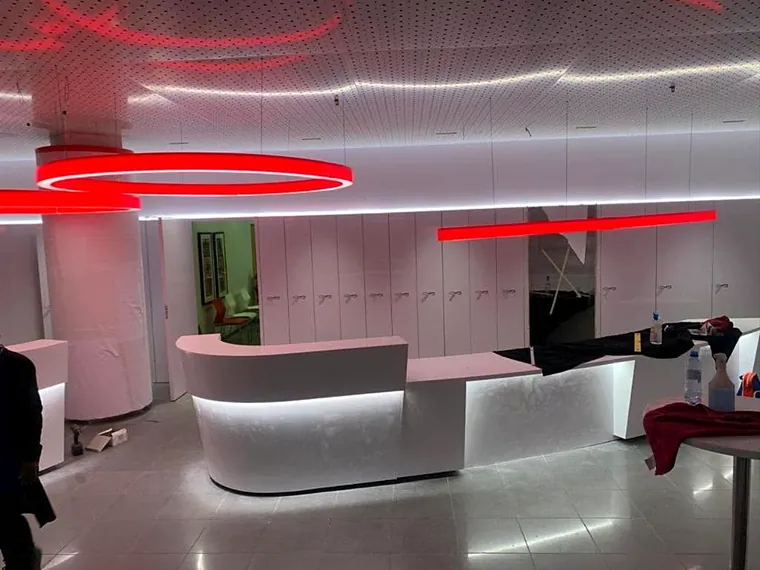Finished curved reception counter lit from beneath